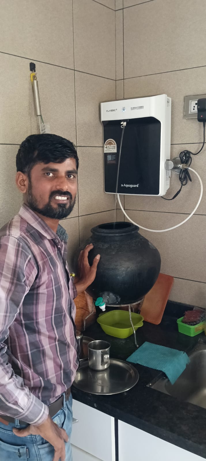 Customer with newly installed Dr. Aquaguard water purifier